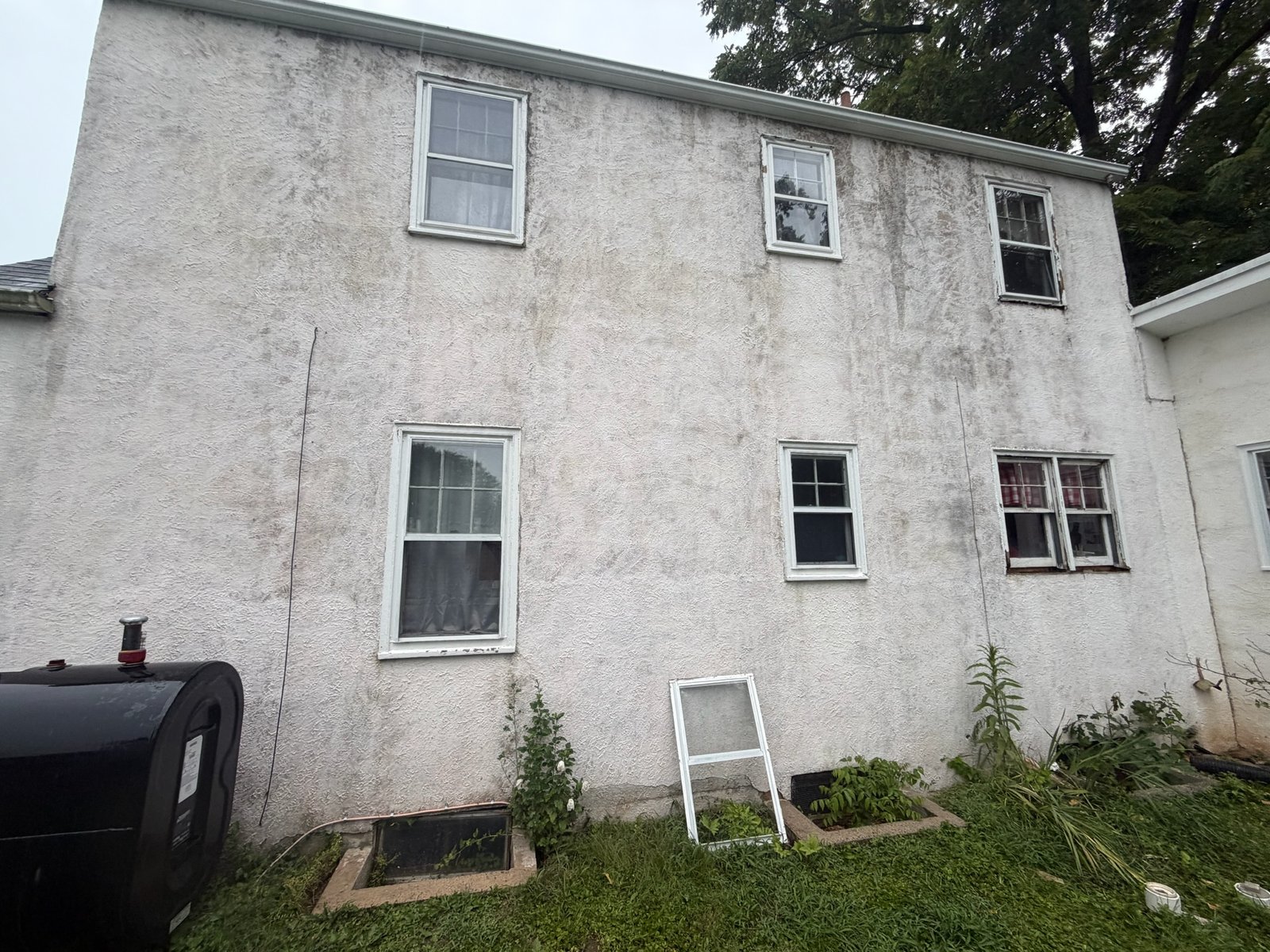 Home exterior restored to a clean and bright finish after professional power washing